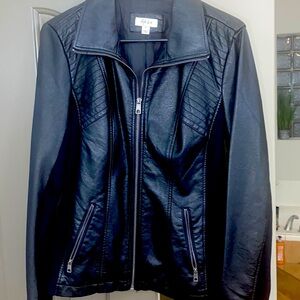 Fairly new women’s black non leather jacket.  Size M Biker style jacket.